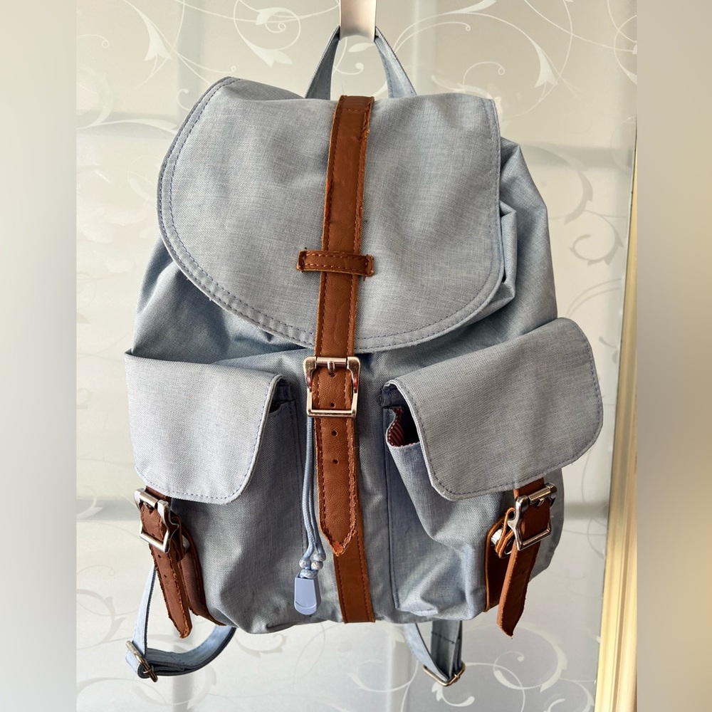 Herschel Dawson backpack in faded denim color. Back padded. Snap and drawstring